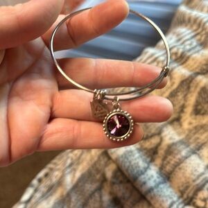 Bracelet with a deep purple gem